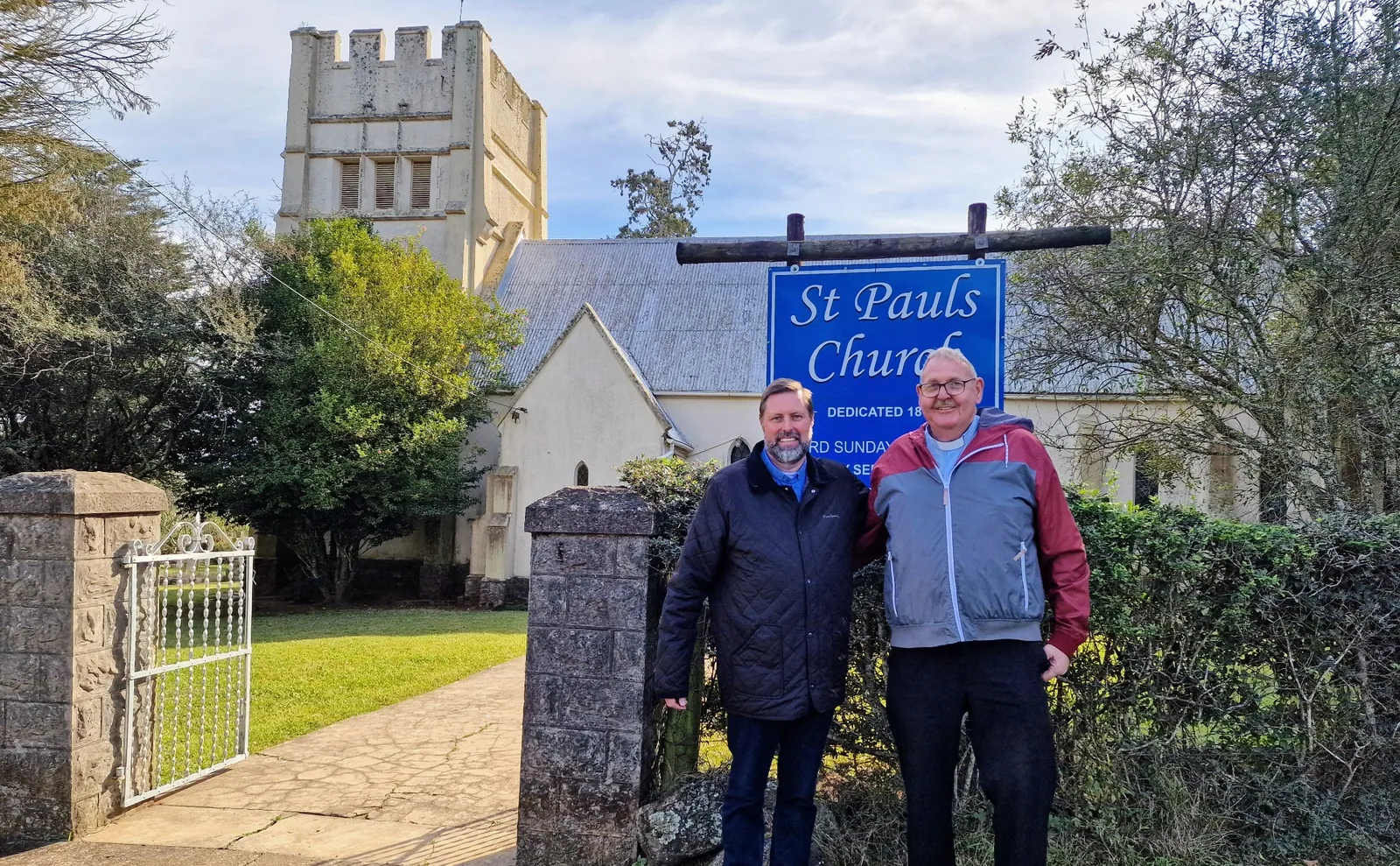 Bishop Ashley Deutschmann with Fr Rodger outside St Paul's Church in South Africa